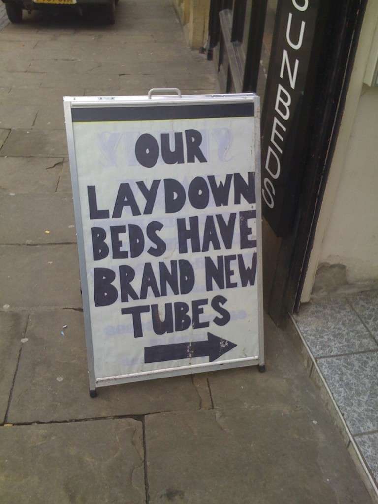 Sign reads: Our laydown beds have brand new tubes