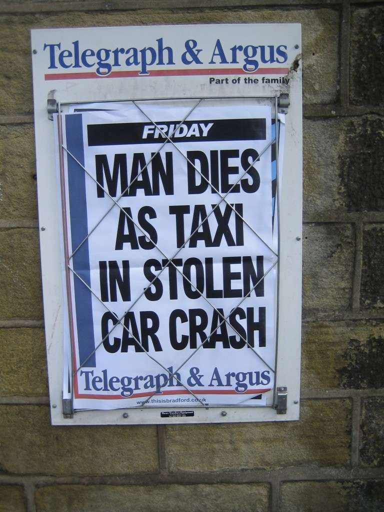 Sign reads: Man dies as taxi in stolen car crash